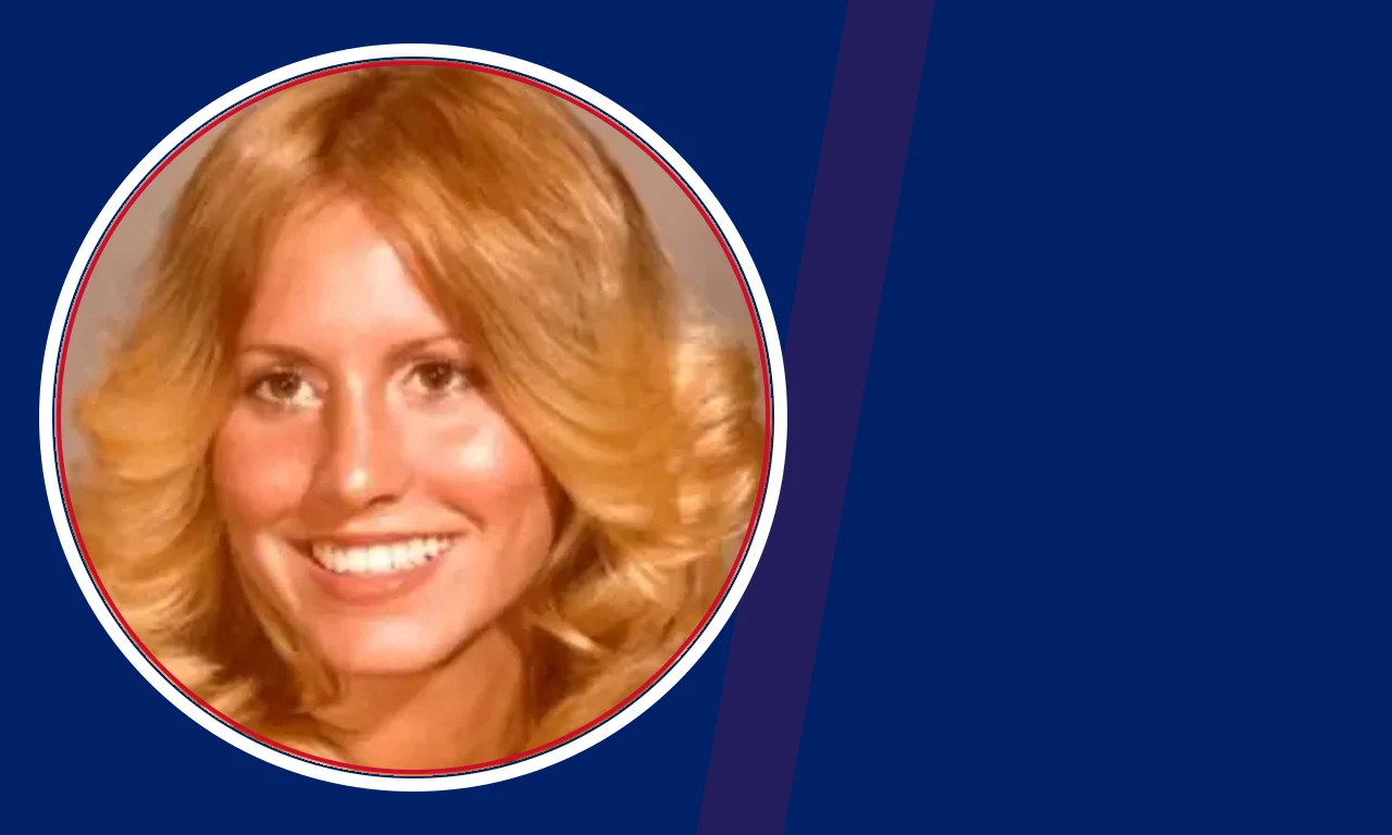 Karen McCollum portrait on navy background